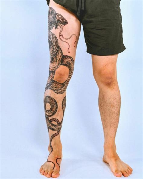 snake wrapped around leg tattoo|Snake tattoo leg